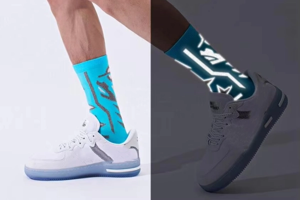 Cycling socks with reflective safety design shown in day and night comparison