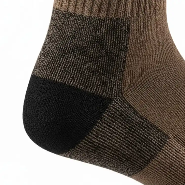 Close-up of reinforced heel detail on brown work boot socks showing durable stitching