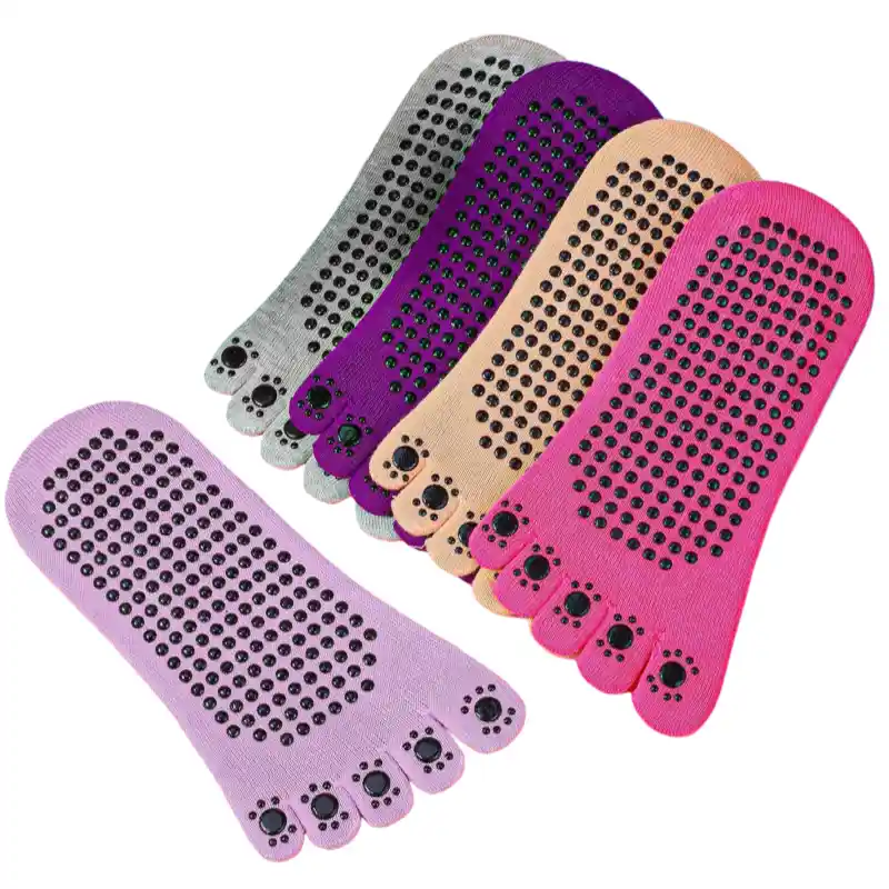 Gray and charcoal yoga toe socks for women with a YOGA elastic strap and non-slip sole grips