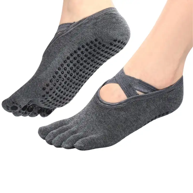 Close-up of beige and pink yoga toe socks for men with cutouts and individual toe pockets Long striped full toe grip socks with detailed views of texture, stretch, and anti-slip grips