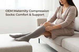 Pregnant woman sitting on a sofa while putting on a pair of maternity compression socks
