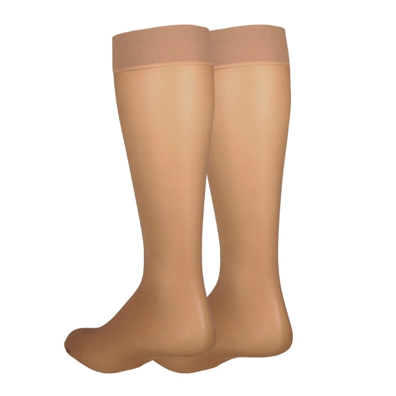 Skin-tone knee-high Sheer Compression Socks with lightweight transparent appearance and smooth fit