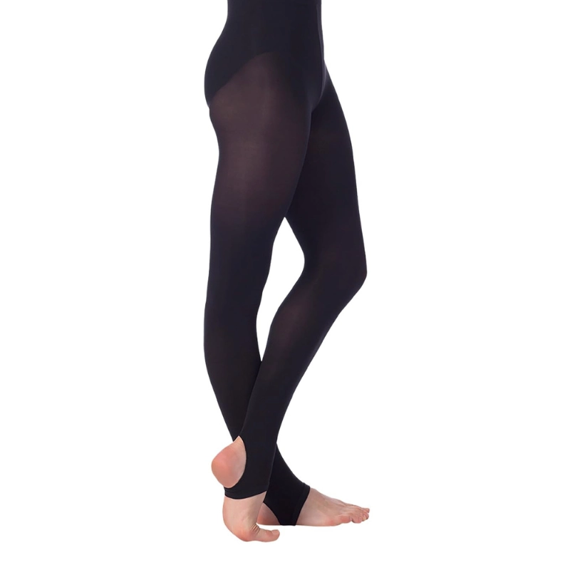 Black stirrup dance tights showing ankle opening and sleek leg fit for studio performance