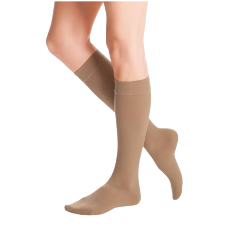 Beige knee high medical compression stockings with closed toe for daily leg fatigue relief