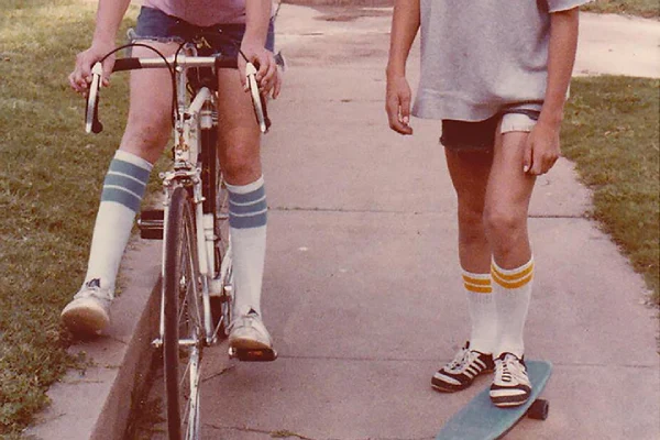 Casual socks three people seated on stairs in socks and sneakers