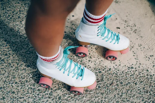 Tube socks with retro roller skates and red striped athletic styling