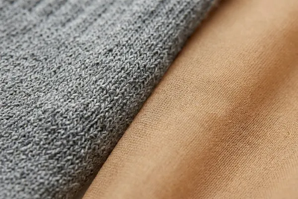 Texture comparison of a coarse knit sock and fine sheer nylon stocking material