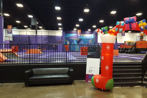 Children jumping at an indoor trampoline park wearing anti-slip grip socks