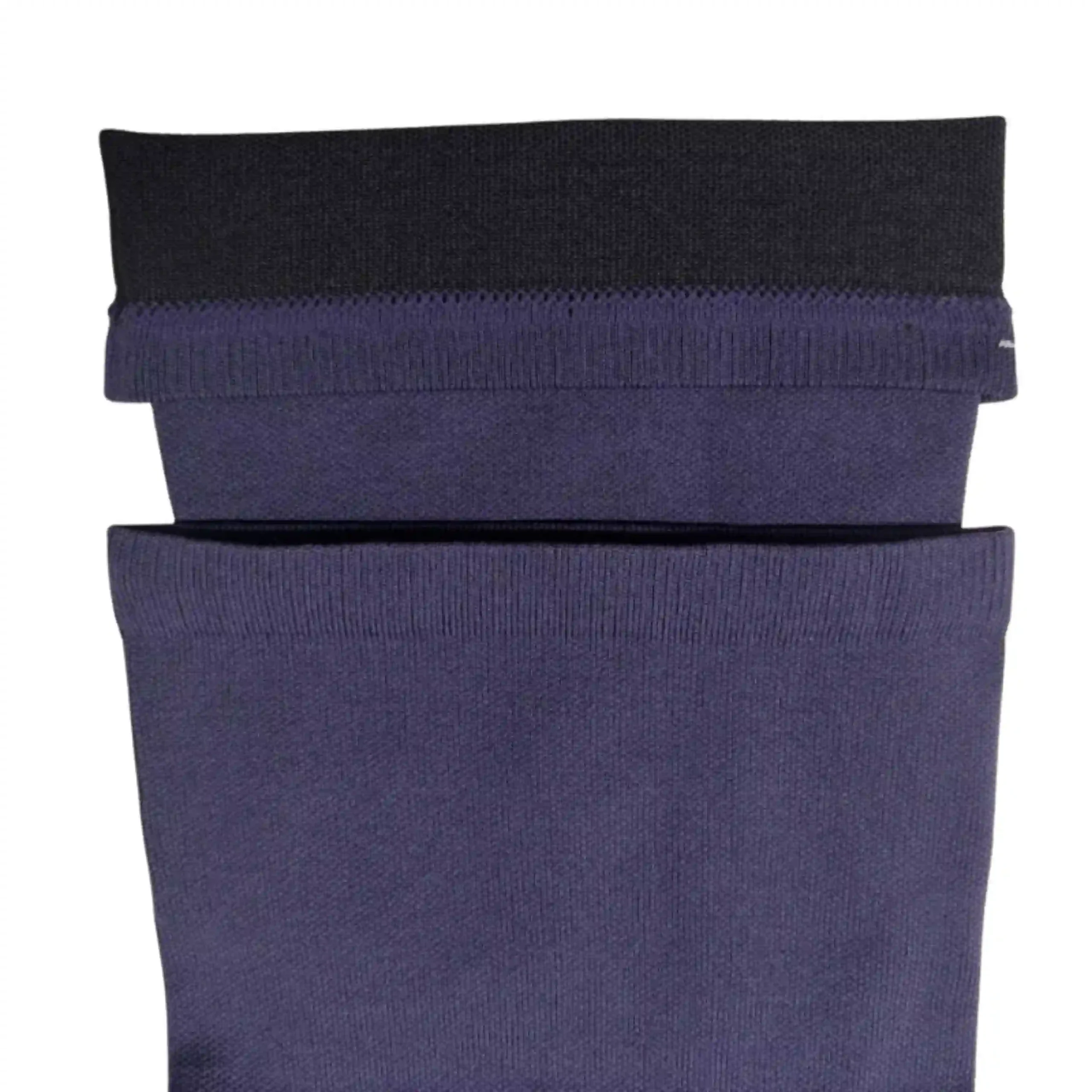 Close up of a wide dark blue ribbed comfort top cuff for compression socks