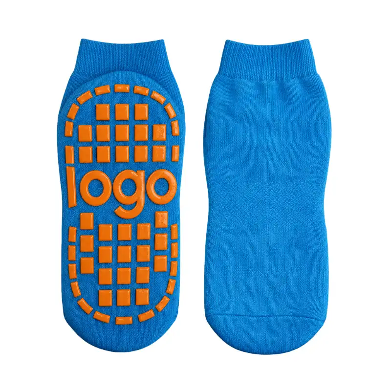Custom blue trampoline socks with orange patterned grips and integrated brand logo space