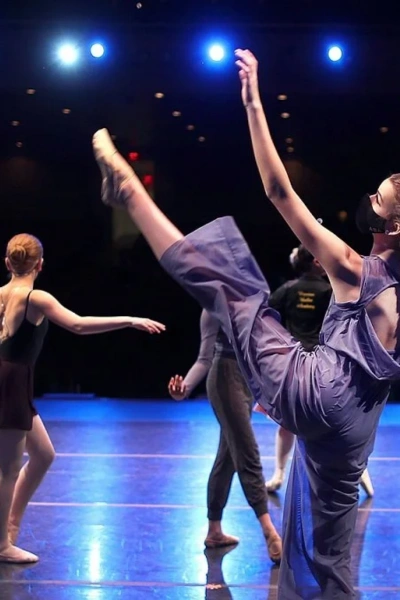 Dance competition team performing in matching costumes