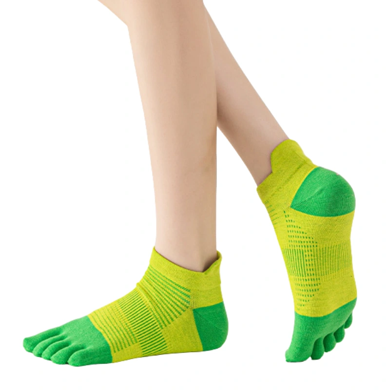 Feet wearing bright green and yellow ankle running toe socks