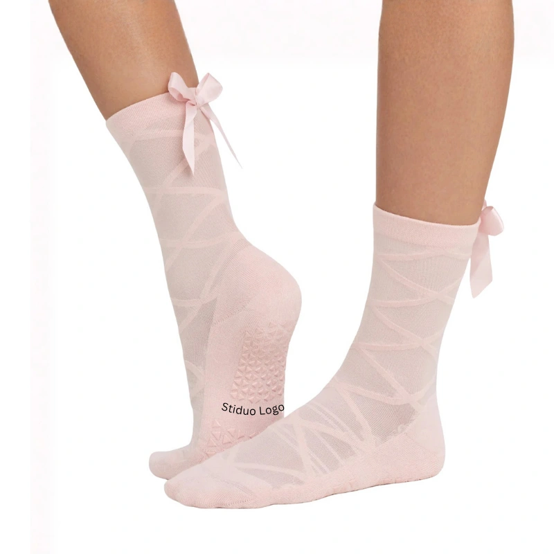 Studio logo grip socks with woven logo and logo-shaped sole grips for dance academies