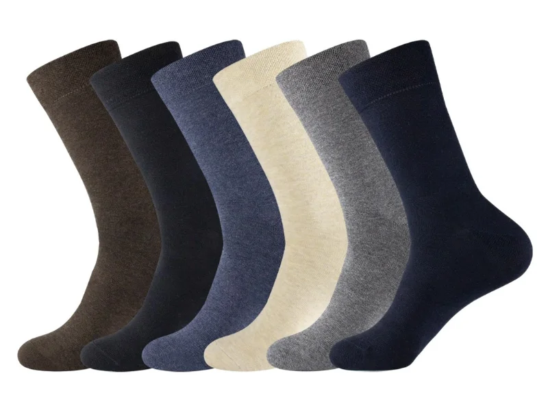 A row of solid crew dress socks in various custom colors including navy brown grey and beige