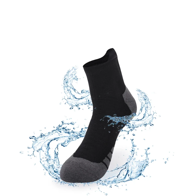 Ankle length black and grey waterproof running socks displaying water repellent performance in a splash effect