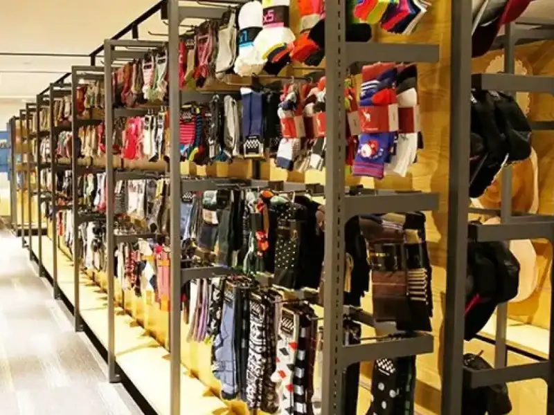 Large warehouse display racks filled with packaged dress socks for wholesale distributors