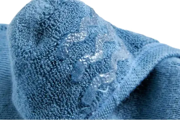 Grip socks, close up of blue terry fabric with thick silicone non slip waves