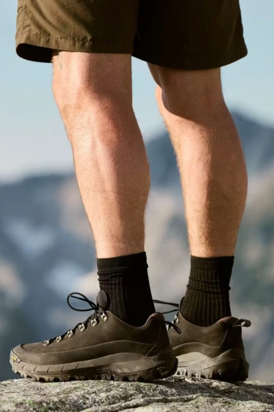 Low hiking shoes paired with black quarter socks for trail walking