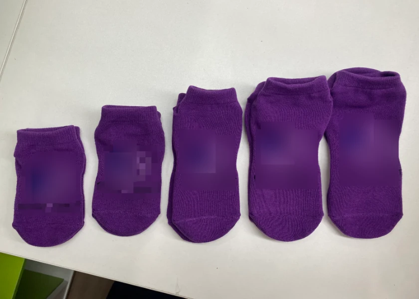 Original photograph of five physical sample sizes, with only customer logos locally softened